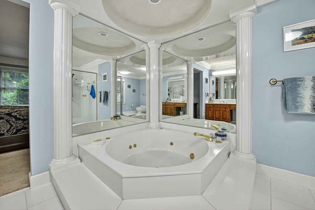 167 Whispering Pne Lane Cherry Log, GA 30522 - Photo 45 of 87 a white bath tub sitting in a bathroom and mirror