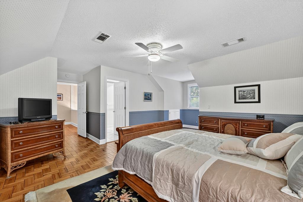 167 Whispering Pne Lane Cherry Log, GA 30522 - Photo 48 of 87 a bedroom with a bed and a flat screen tv