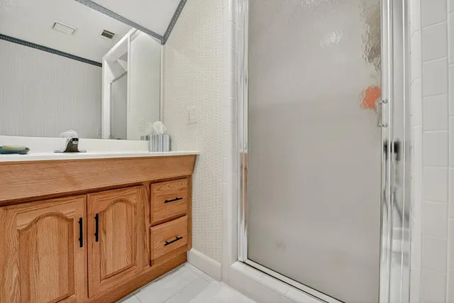 a view of backyard of house with green space