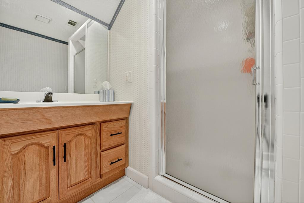 167 Whispering Pne Lane Cherry Log, GA 30522 - Photo 50 of 87 a bathroom with a sink a vanity and a mirror