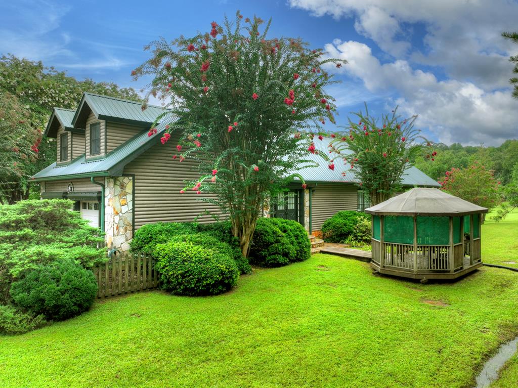 167 Whispering Pne Lane Cherry Log, GA 30522 - Photo 68 of 87 a view of a house with a yard and sitting area