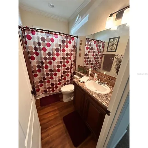 a bathroom with a sink and mirror
