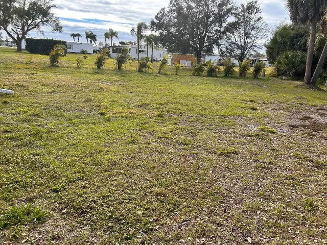 a view of a yard with swimming pool
