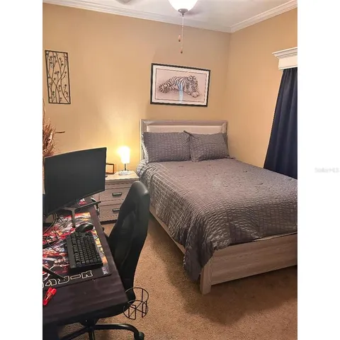 a bedroom with a bed and furniture