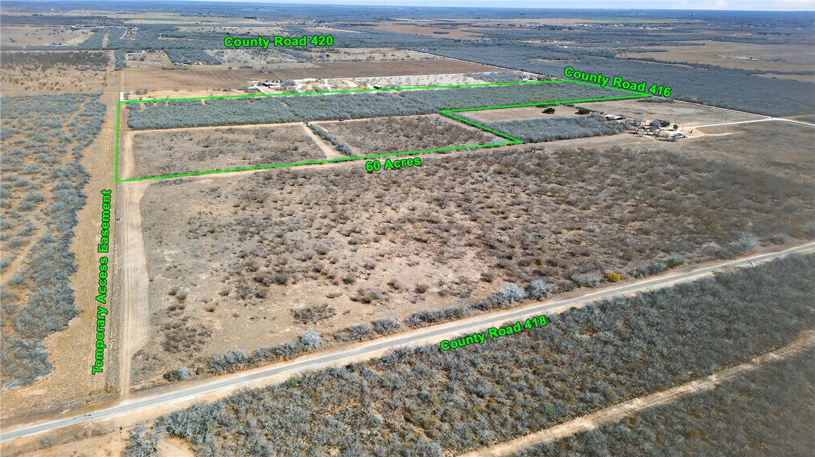416 Cr Premont, TX 78375 - Photo 11 of 13 a view of a road with a building in the background