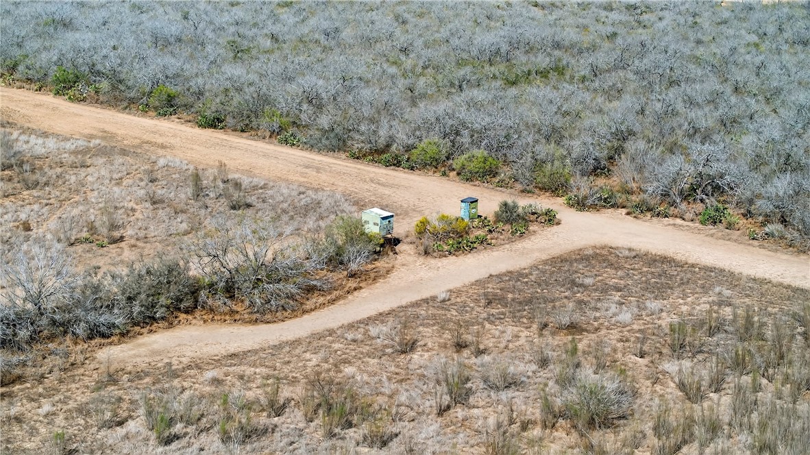 416 Cr Premont, TX 78375 - Photo 12 of 13 a view of a road with a mountain view in the background
