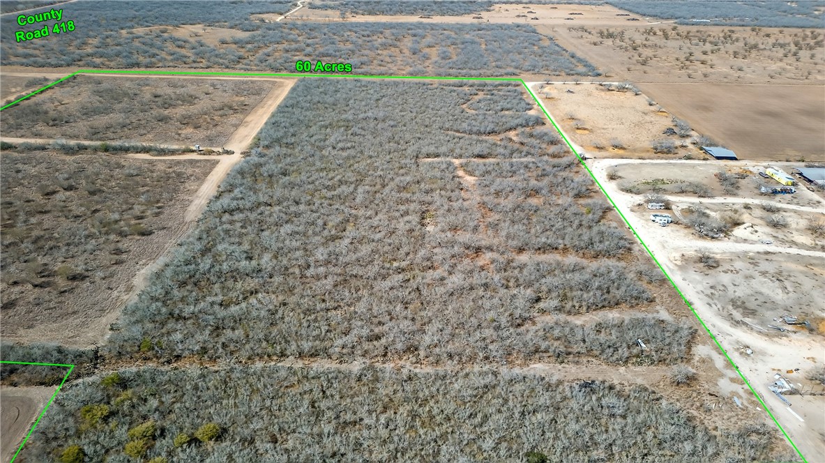 416 Cr Premont, TX 78375 - Photo 5 of 13 a view of a dry yard with wooden floor