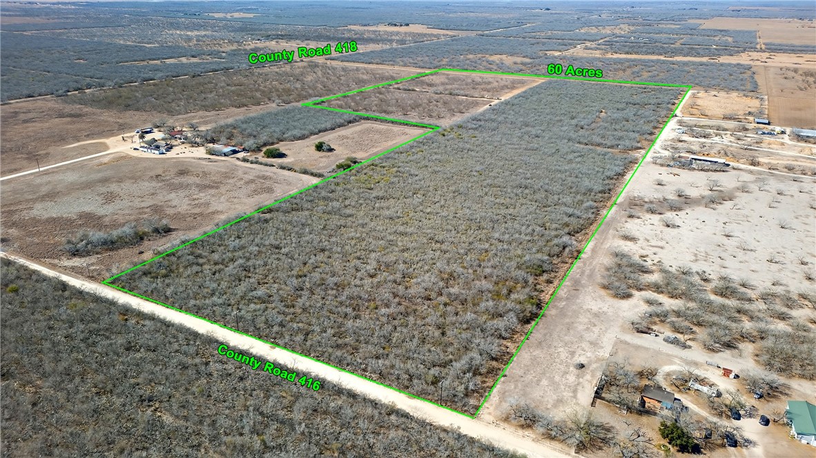 416 Cr Premont, TX 78375 - Photo 6 of 13 a view of a yard with wooden fence