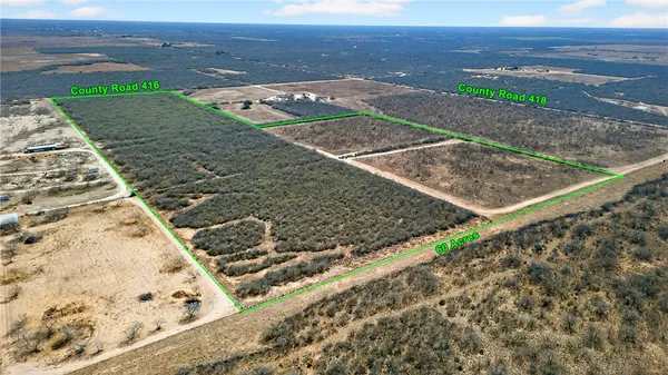 a view of a road with a building in the background