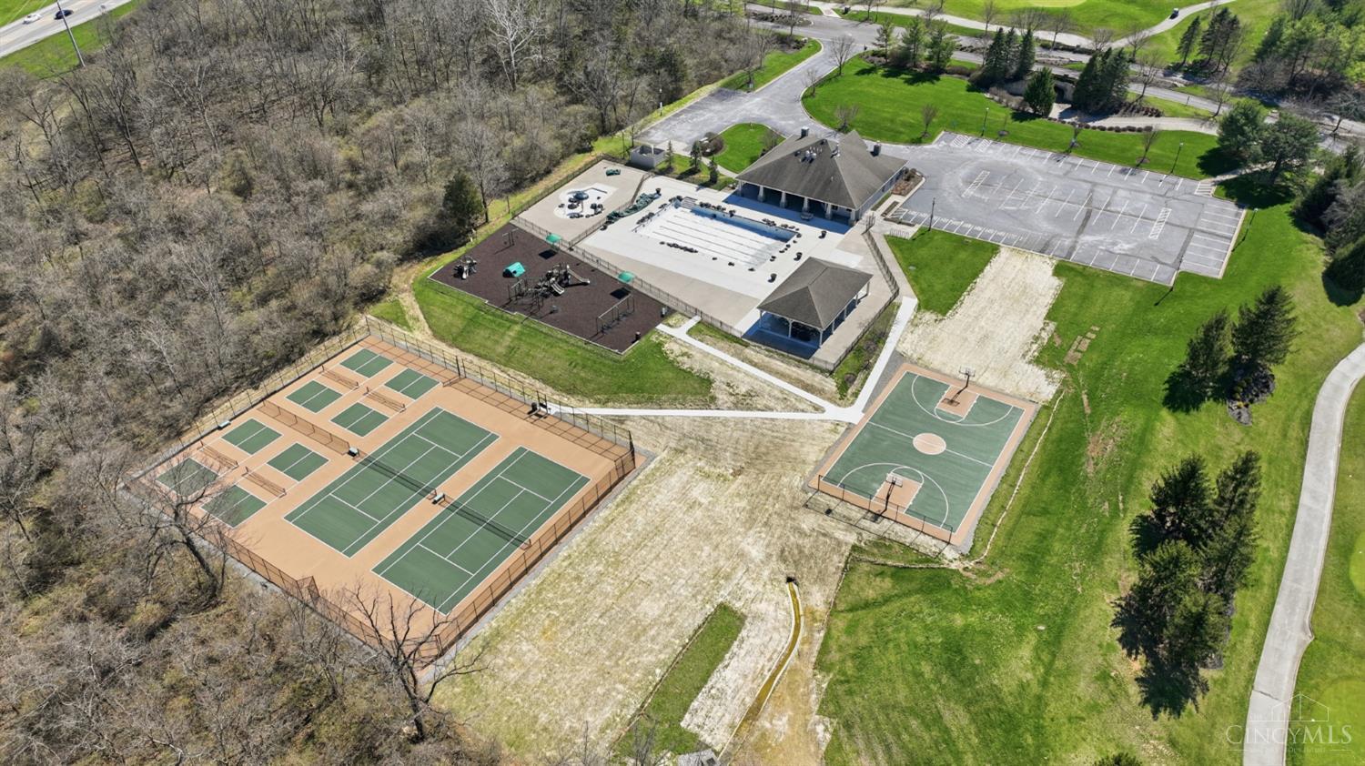 1054 Observatory Point Maineville, OH 45039 - Photo 82 of 82 View of the newly resurfaced tennis courts, pickleball courts, basketball court, kids playground, pool and fitness center.