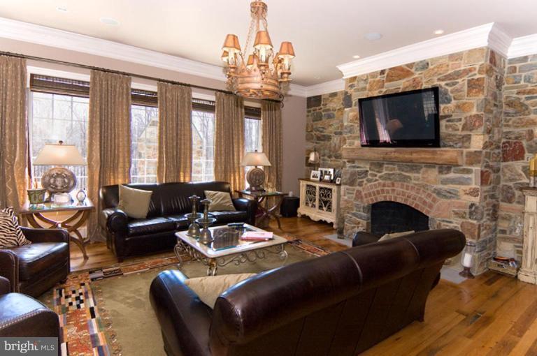 905 Hayfields Road Cockeysville, MD 21030 - Photo 2 of 17 a living room with furniture a flat screen tv and a fireplace