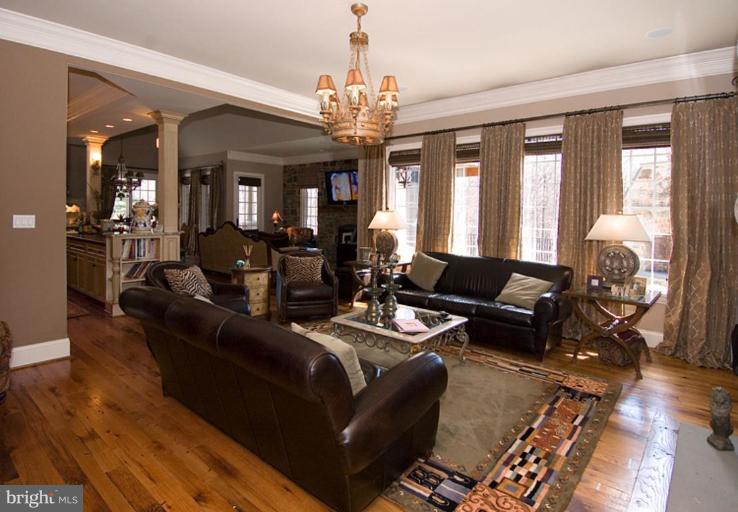 905 Hayfields Road Cockeysville, MD 21030 - Photo 3 of 17 a living room with fireplace furniture and a chandelier