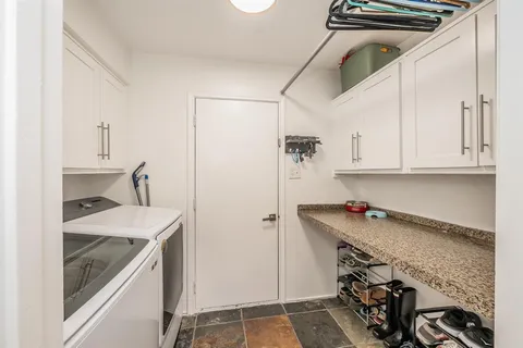 a kitchen with a sink a stove and a refrigerator