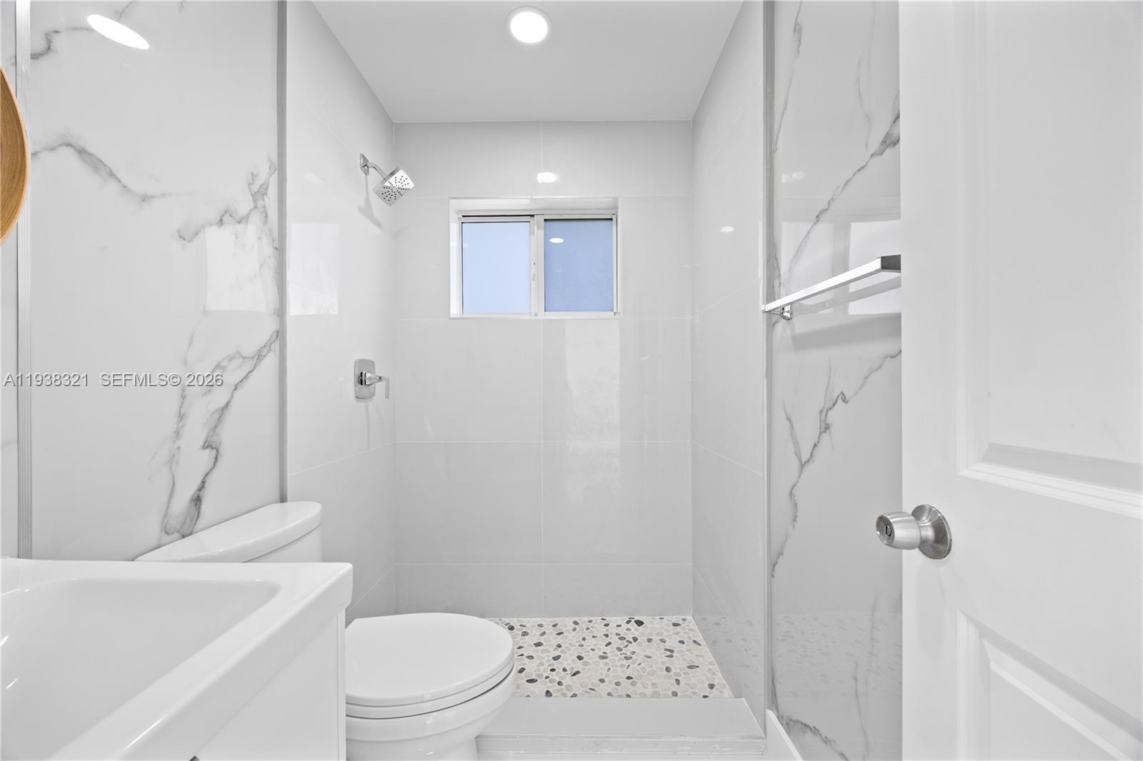 22503 Southwest 113th Place Miami, FL 33170 - Photo 13 of 35 a bathroom with a sink a toilet and shower