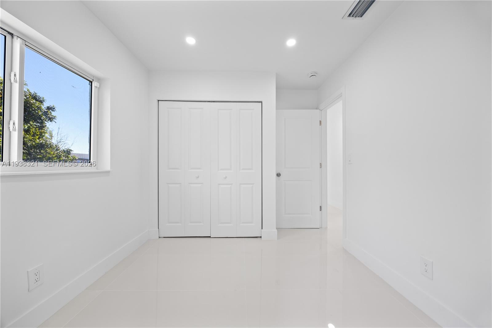22503 Southwest 113th Place Miami, FL 33170 - Photo 15 of 35 an empty room with a window