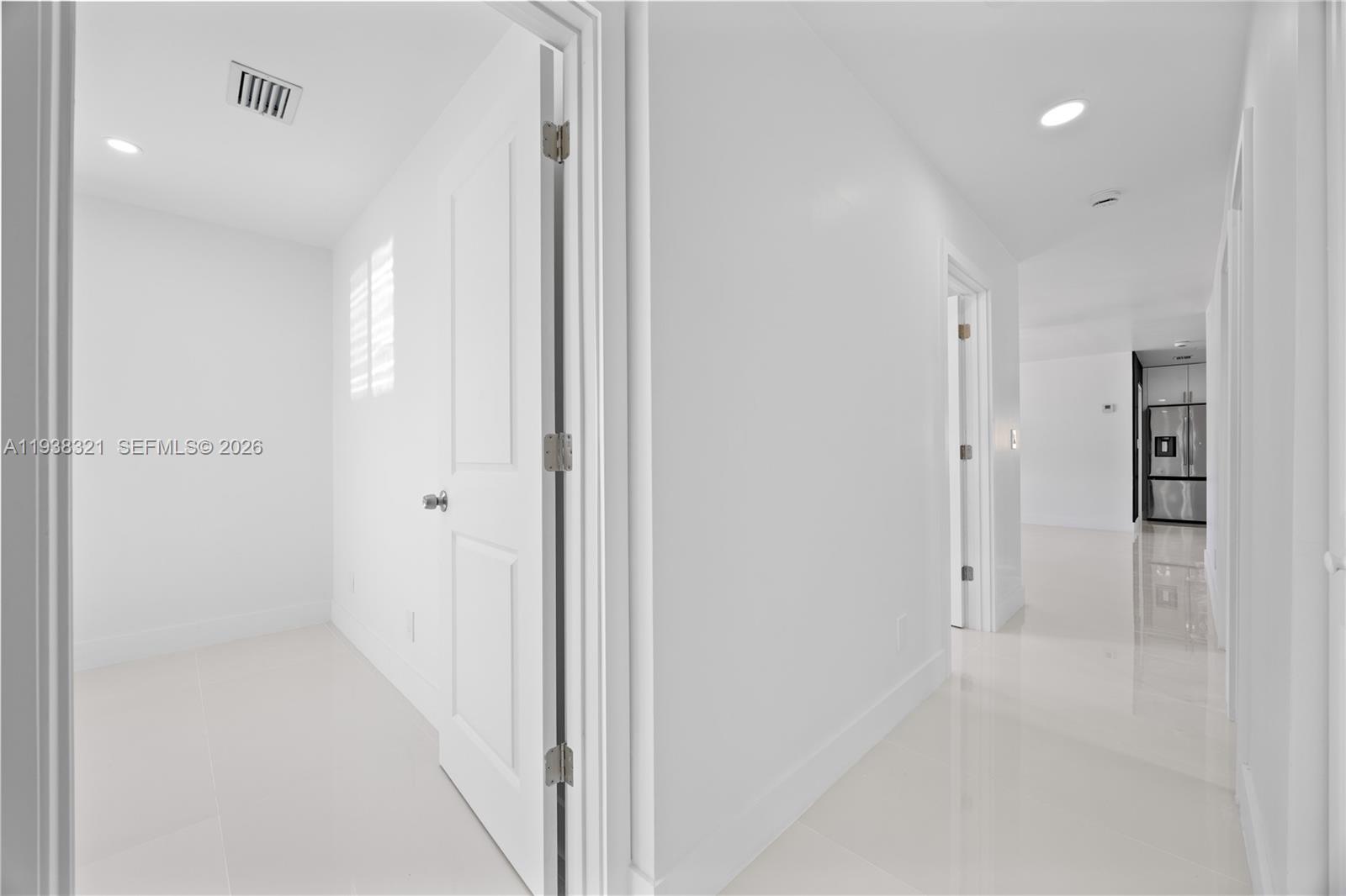 22503 Southwest 113th Place Miami, FL 33170 - Photo 17 of 35 a view of a hallway with wooden floor
