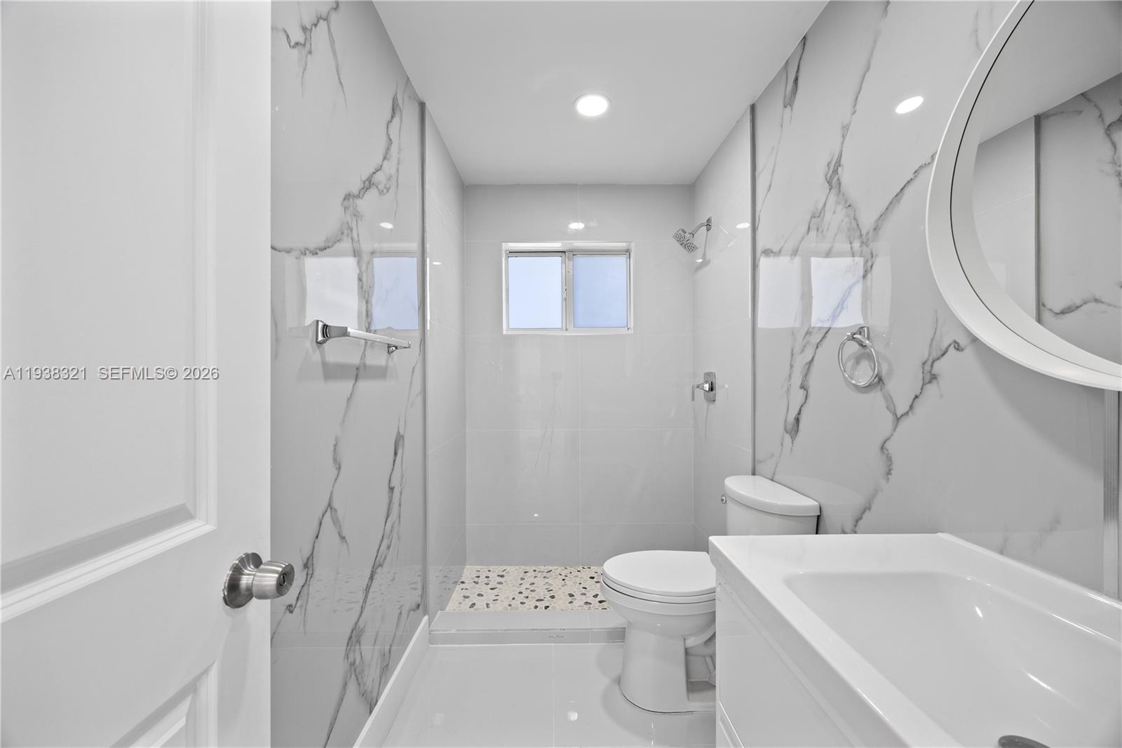 22503 Southwest 113th Place Miami, FL 33170 - Photo 22 of 35 a bathroom with a sink a toilet and shower