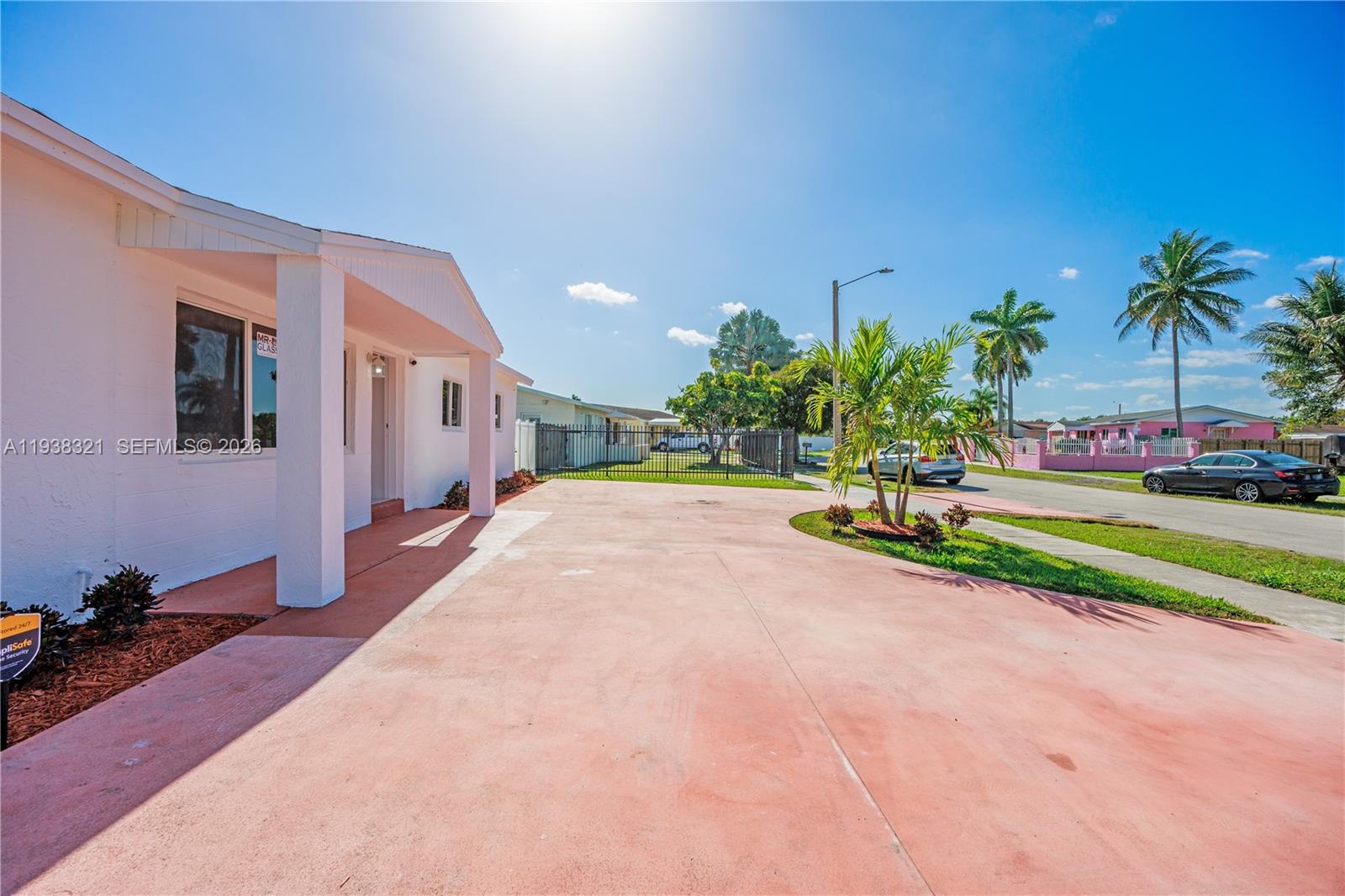 22503 Southwest 113th Place Miami, FL 33170 - Photo 30 of 35 a view of a house with a yard and potted plants