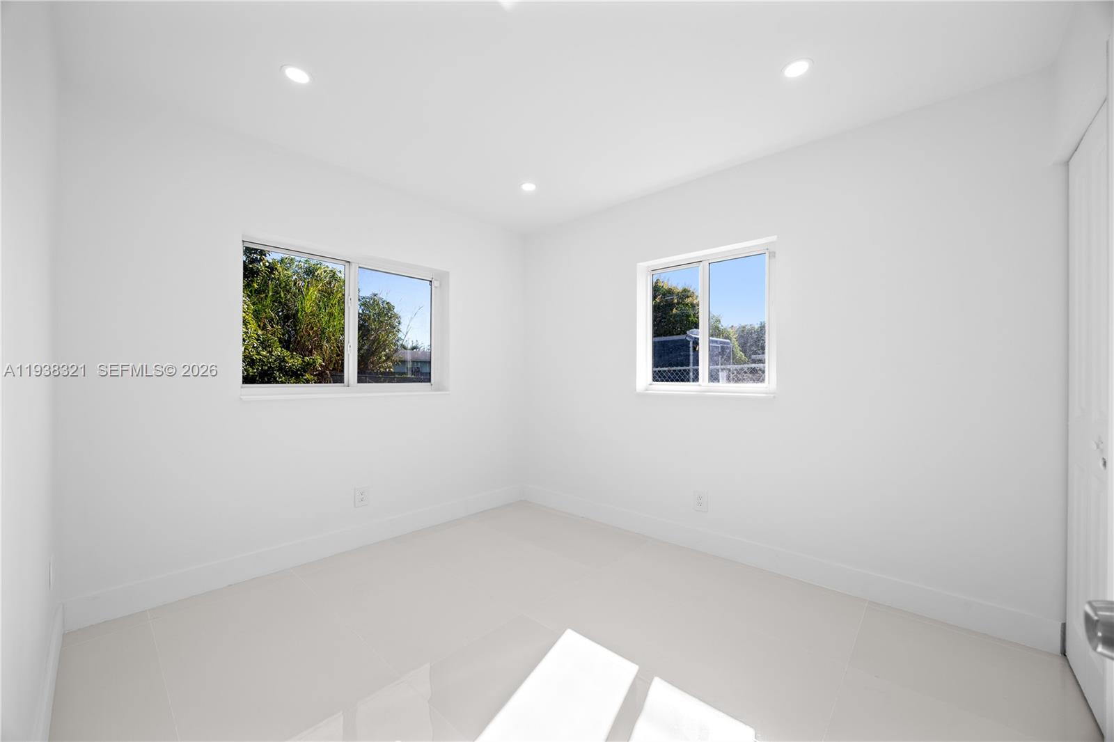 22503 Southwest 113th Place Miami, FL 33170 - Photo 9 of 35 an empty room with windows
