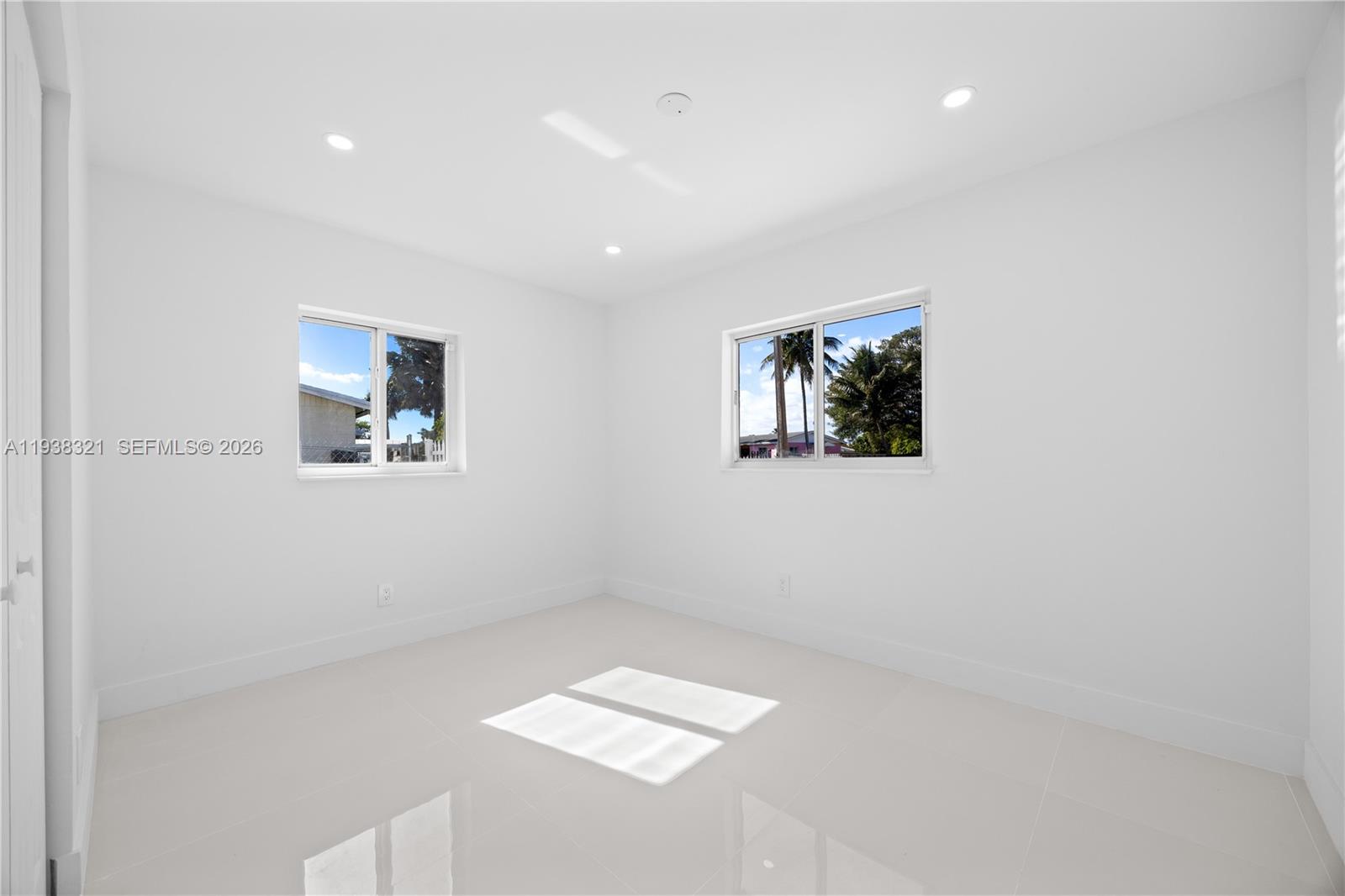 22503 Southwest 113th Place Miami, FL 33170 - Photo 10 of 35 a view of room with window and hardwood floor