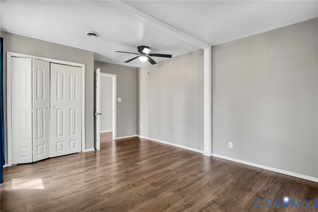 4740 West Grey Fox Circle Gum Spring, VA 23065 - Photo 13 of 21 a view of an empty room with wooden floor