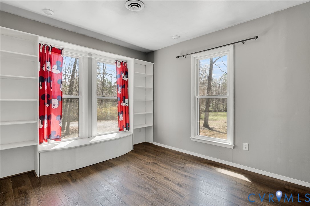 4740 West Grey Fox Circle Gum Spring, VA 23065 - Photo 15 of 21 an empty room with wooden floor and windows