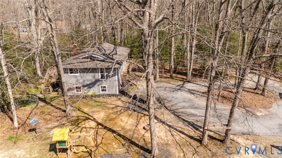 4740 West Grey Fox Circle Gum Spring, VA 23065 - Photo 18 of 21 a view of building along with trees