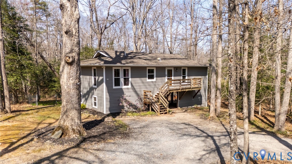 4740 West Grey Fox Circle Gum Spring, VA 23065 - Photo 2 of 21 a view of a house with large trees and furniture