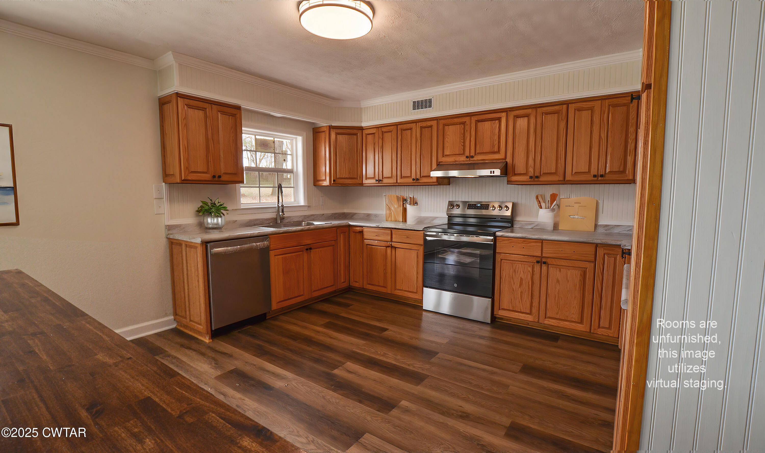 173 West Main Street Bells, TN 38006 - Photo 11 of 19 a kitchen with stainless steel appliances granite countertop a stove a sink dishwasher and a refrigerator