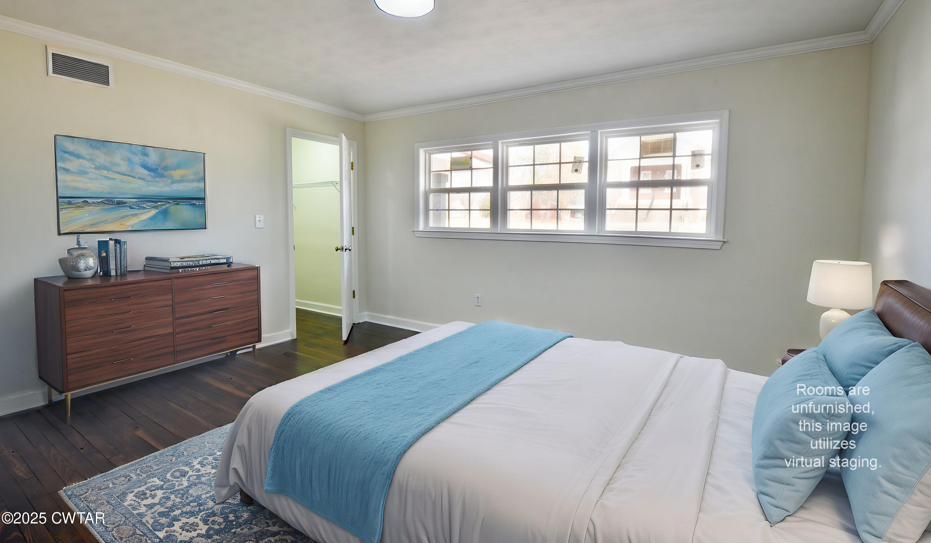 173 West Main Street Bells, TN 38006 - Photo 13 of 19 a bedroom with a bed and a dresser next to a window