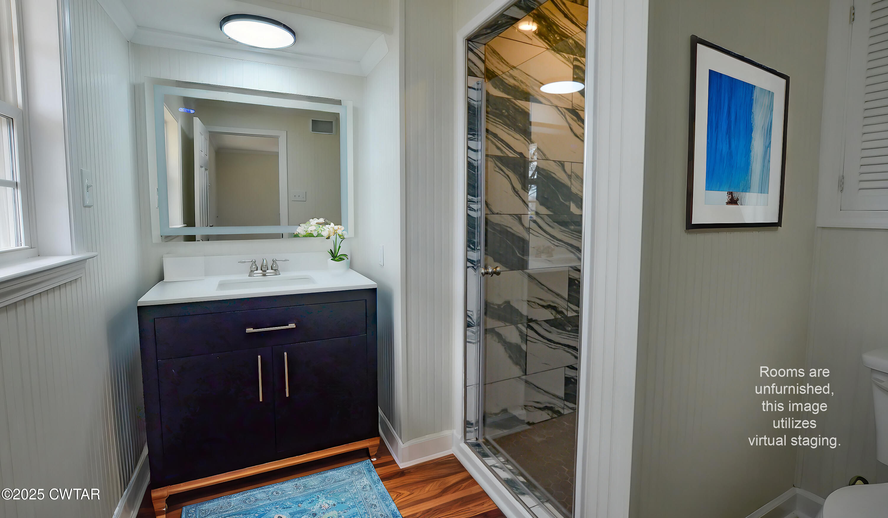 173 West Main Street Bells, TN 38006 - Photo 17 of 19 a bathroom with a sink a mirror and a shower