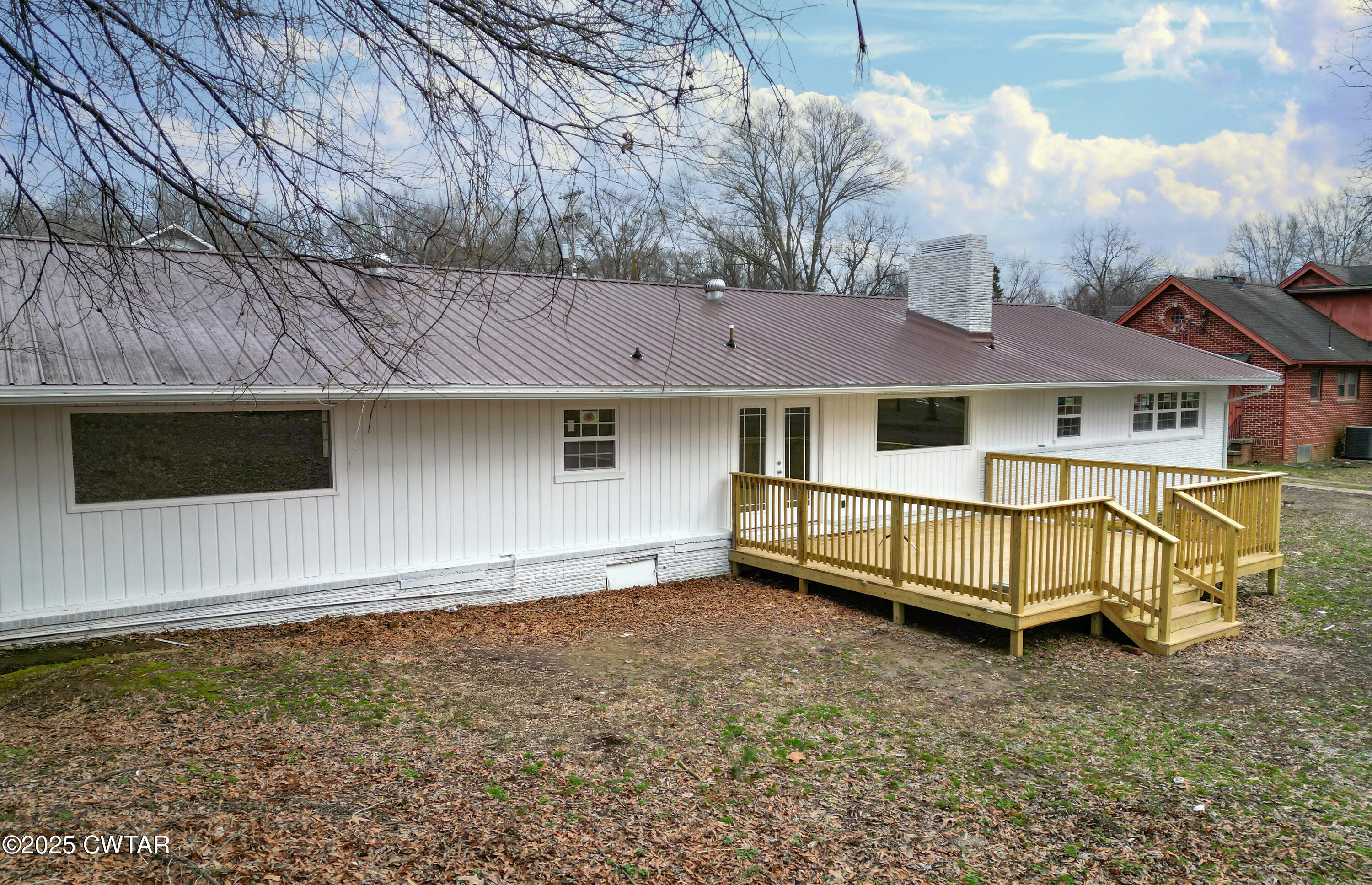 173 West Main Street Bells, TN 38006 - Photo 3 of 19 a view of a house with a yard and wooden fence
