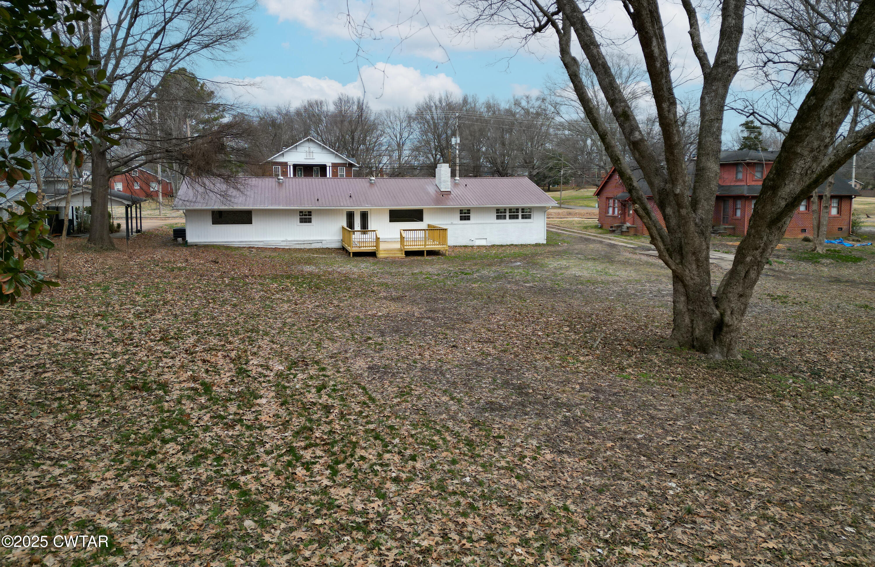 173 West Main Street Bells, TN 38006 - Photo 4 of 19 a front view of a house with a yard