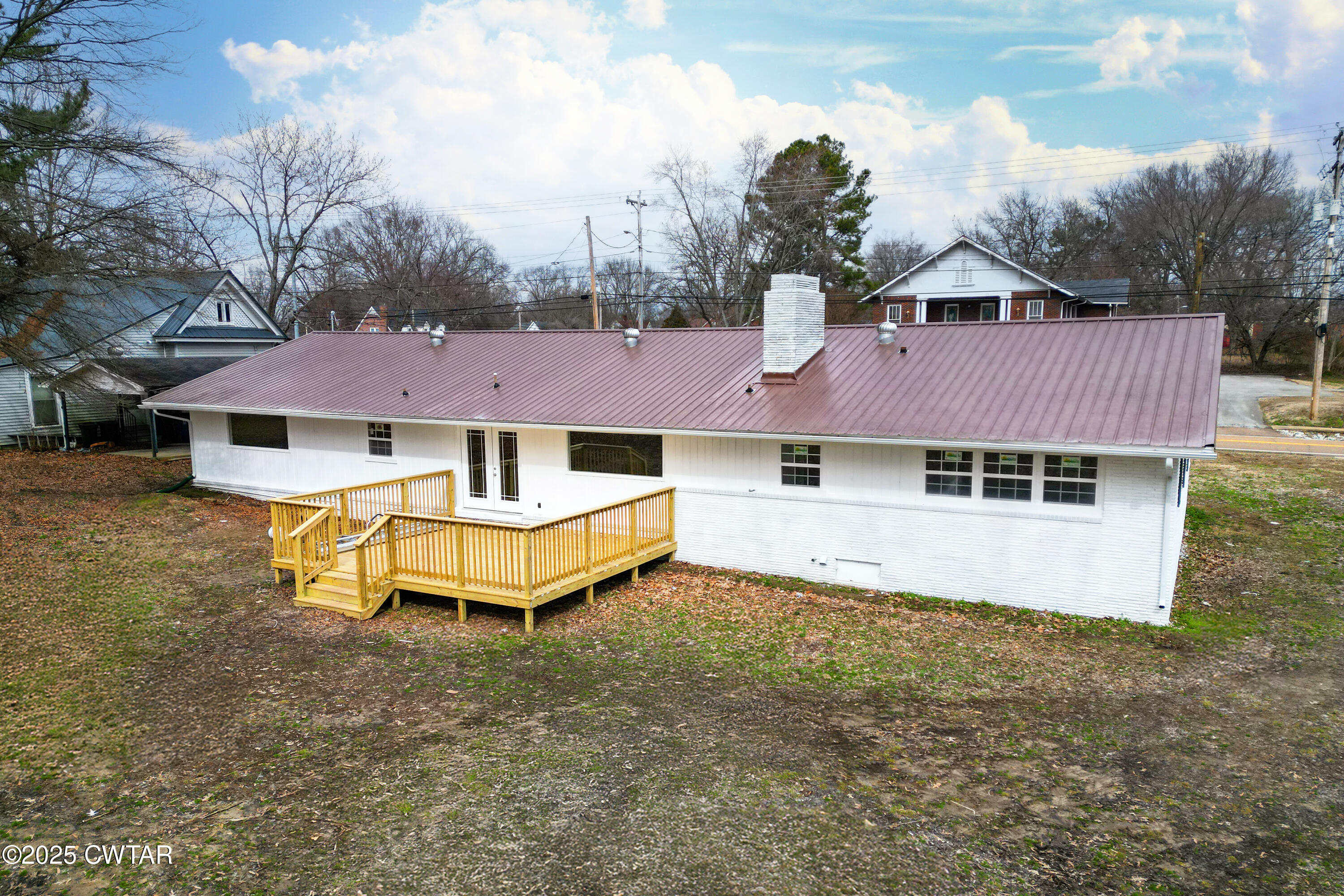 173 West Main Street Bells, TN 38006 - Photo 6 of 19 a view of a house with a yard and roof