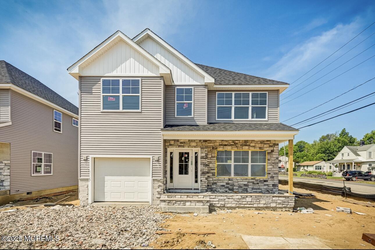 72 Manchester Avenue Keyport, NJ 07735 - Photo 1 of 4 a front view of a house with a yard