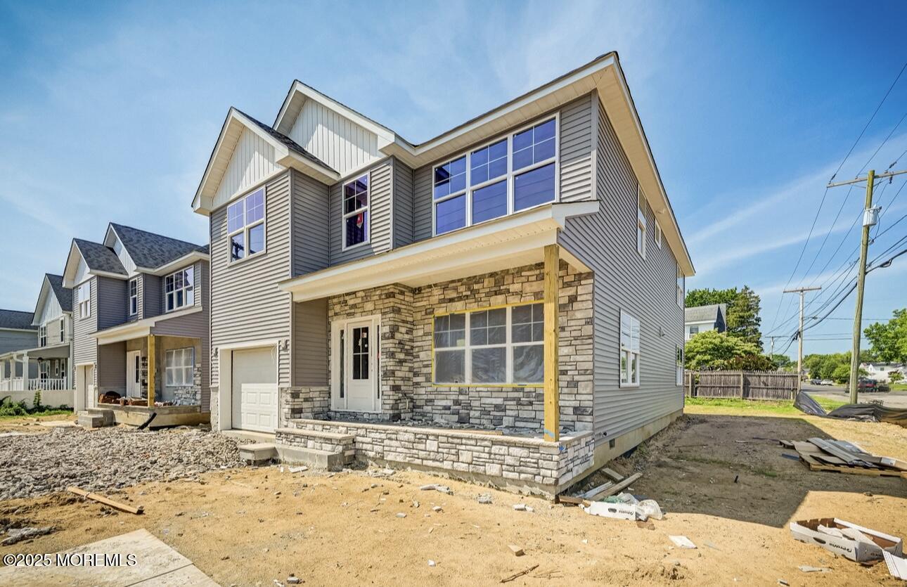 72 Manchester Avenue Keyport, NJ 07735 - Photo 2 of 4 a view of a house with many windows