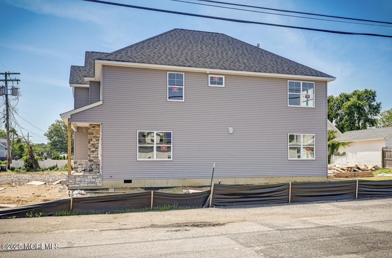 72 Manchester Avenue Keyport, NJ 07735 - Photo 3 of 4 a front view of a house with a road