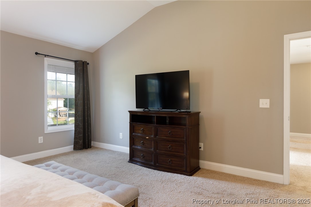 40 Cherry Hill Drive Lillington, NC 27546 - Photo 14 of 30 a living room with furniture and a flat screen tv