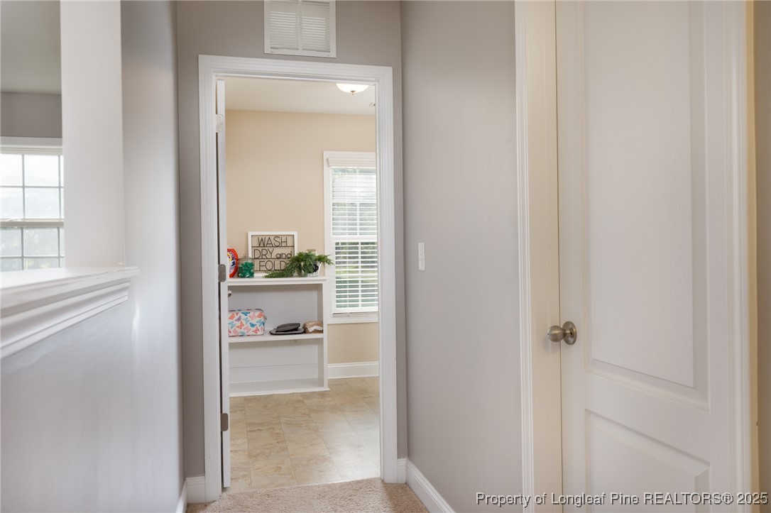 40 Cherry Hill Drive Lillington, NC 27546 - Photo 17 of 30 a bathroom with a glass shower door and a window