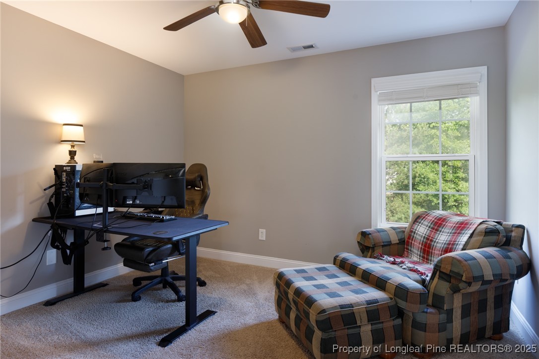 40 Cherry Hill Drive Lillington, NC 27546 - Photo 23 of 30 a livingroom with workspace and a window