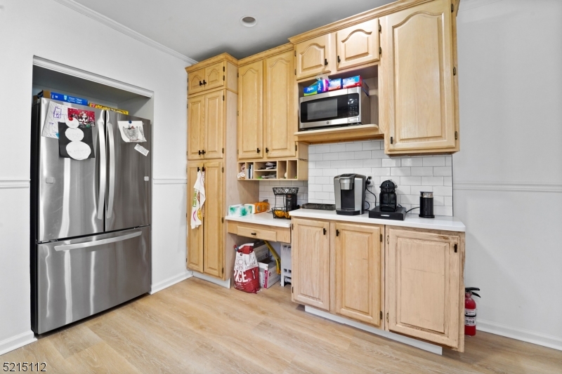 36 Dunnell Road Maplewood, NJ 07040 - Photo 11 of 35 a kitchen with stainless steel appliances granite countertop a refrigerator and a microwave