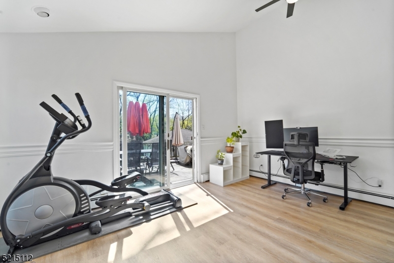 36 Dunnell Road Maplewood, NJ 07040 - Photo 17 of 35 a room with gym equipment and a large window