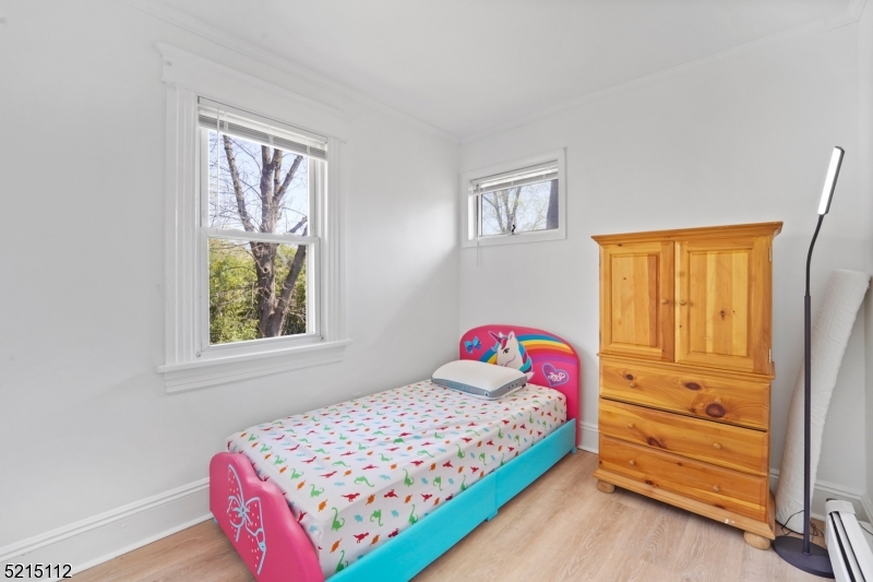 36 Dunnell Road Maplewood, NJ 07040 - Photo 22 of 35 a bedroom with a bed and a window