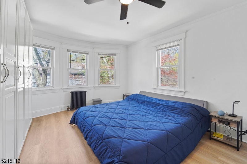 36 Dunnell Road Maplewood, NJ 07040 - Photo 26 of 35 a bed sitting in a bedroom next to a window
