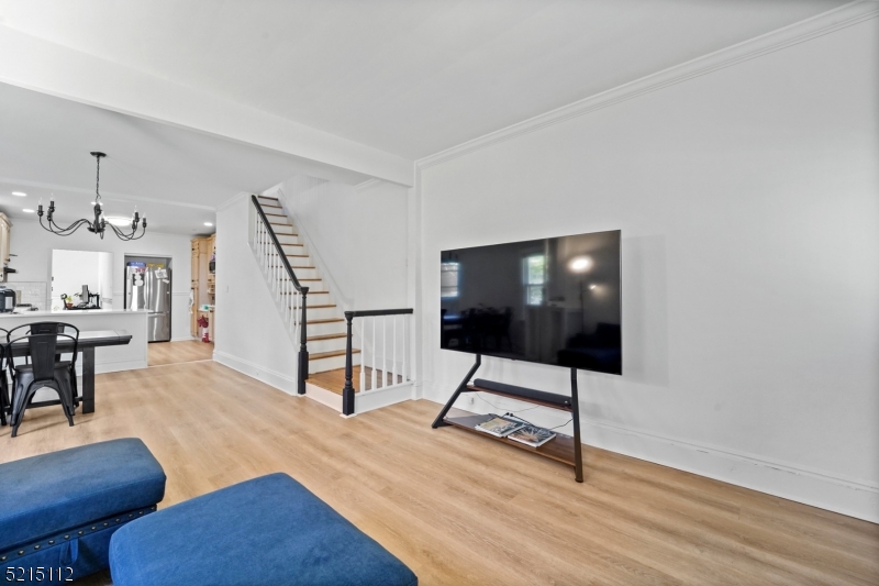 36 Dunnell Road Maplewood, NJ 07040 - Photo 6 of 35 a view of a livingroom with furniture and wooden floor