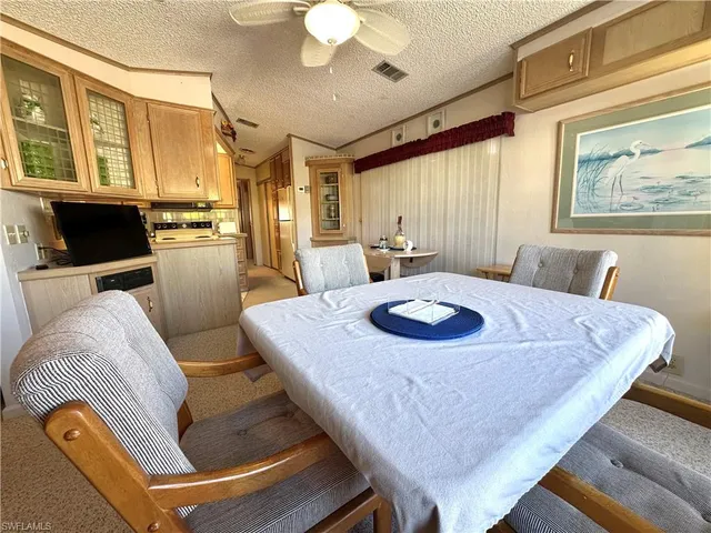 a living room with furniture and flat screen tv