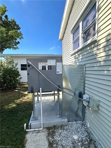a view of a patio with a table and chairs