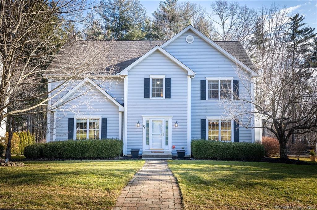 25 Lynn Place Ridgefield, CT 06877 - Photo 1 of 1 a view of a brick house with a yard plants and large trees