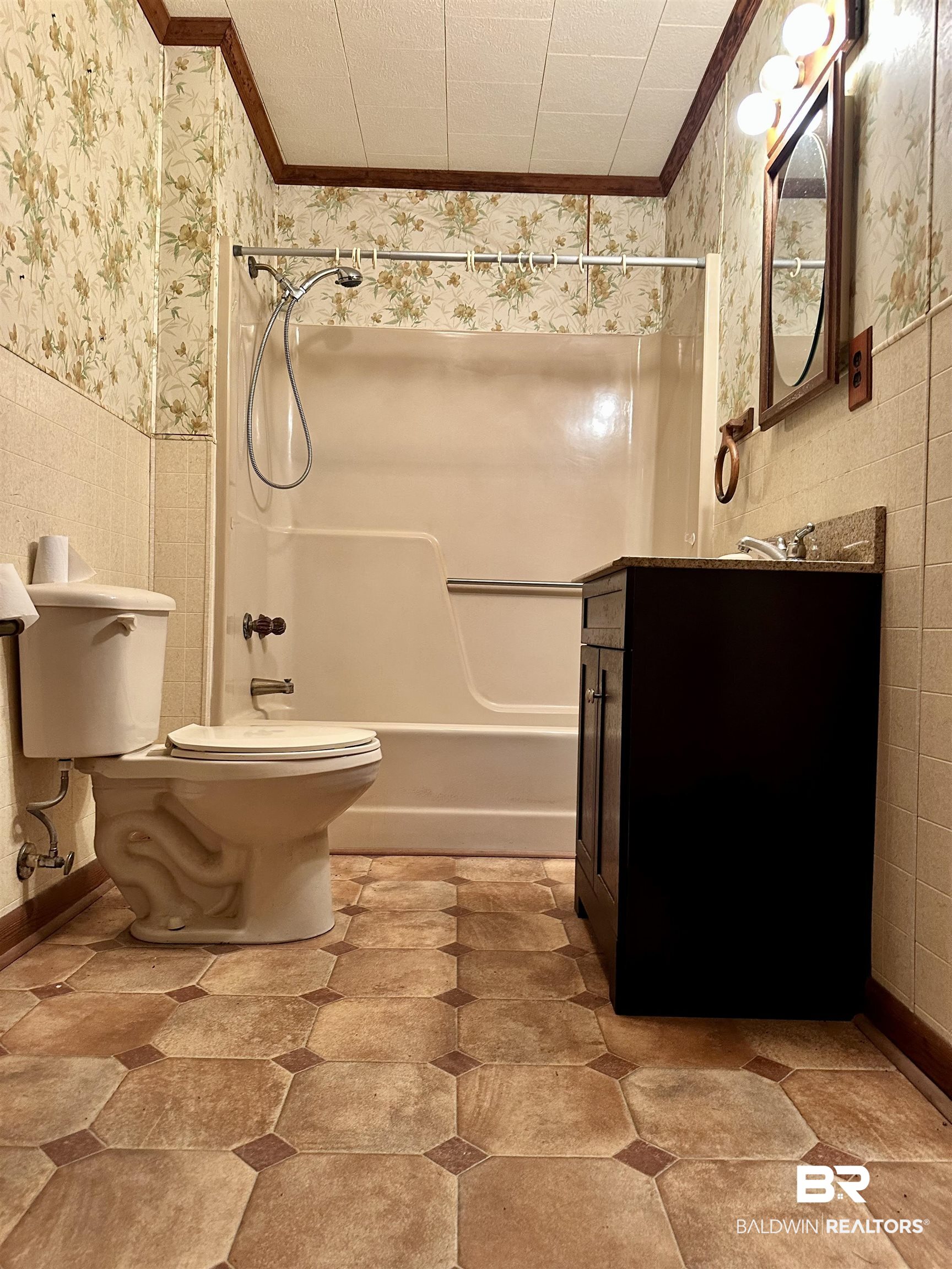 1081 Jay Road Brewton, AL 36426 - Photo 11 of 19 Full bathroom with crown molding, tub / shower combination, vanity, and toilet
