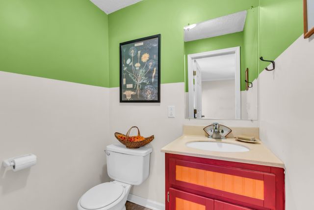 a view of a livingroom with furniture and a flat screen tv